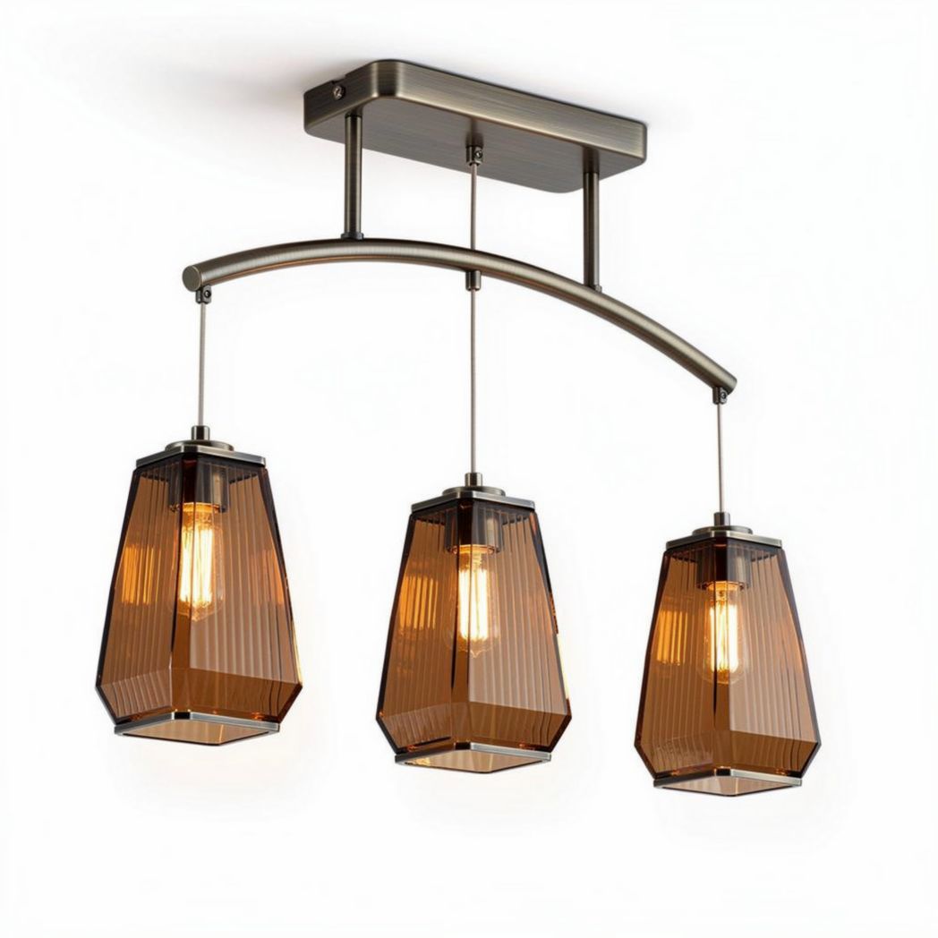 Three pendant light fixtures with amber glass shades and brushed nickel finish