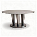 Round dining table in silver metal finish with a sleek modern design
